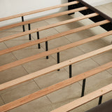 King bed, nightstand - brass studs adorn the headboard